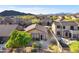 Aerial view of a single story home in a desert community with mountain views at 3517 N Paseo Del Sol --, Mesa, AZ 85207