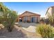 Backyard view showcasing landscaping, patio, and natural desert vegetation at 3517 N Paseo Del Sol --, Mesa, AZ 85207