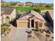 Single-story home with desert landscaping, tile roof, and spacious driveway with golf course and mountain views at 3517 N Paseo Del Sol --, Mesa, AZ 85207