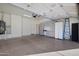 Organized garage with cabinetry, workspace, and ample room for parking and storage at 3517 N Paseo Del Sol --, Mesa, AZ 85207