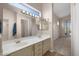Bright main bathroom with dual vanities, large mirrors, and access to a linen closet at 3517 N Paseo Del Sol --, Mesa, AZ 85207