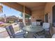 Inviting covered back patio with outdoor seating and BBQ area at 35487 N Shorthorn Trl, San Tan Valley, AZ 85143