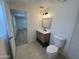 Modern bathroom featuring elegant fixtures, a stylish vanity, and contemporary design at 3807 N 64Th Dr, Phoenix, AZ 85033