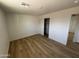 Inviting bedroom featuring hardwood floors and a closet offering functionality and style at 3807 N 64Th Dr, Phoenix, AZ 85033
