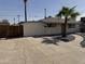 Charming single-story home featuring desert landscaping and a spacious concrete driveway at 3807 N 64Th Dr, Phoenix, AZ 85033