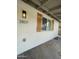 Close-up of exterior showcasing shutters, modern lighting, and house number at 3807 N 64Th Dr, Phoenix, AZ 85033