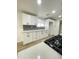 Bright kitchen with stainless steel appliances, quartz countertops, and stylish backsplash at 3807 N 64Th Dr, Phoenix, AZ 85033