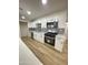 Well-equipped kitchen featuring stainless steel appliances and modern finishes at 3807 N 64Th Dr, Phoenix, AZ 85033