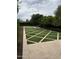 Inviting backyard featuring an artificial turf design and a brick fire pit area for outdoor relaxation and enjoyment at 4145 E Libby St, Phoenix, AZ 85032