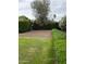 A backyard showcasing privacy hedges, gravel landscaping, and a serene atmosphere at 4145 E Libby St, Phoenix, AZ 85032