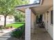 Inviting covered porch with brick pillars, offering a shady retreat at 4145 E Libby St, Phoenix, AZ 85032