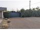 Spacious driveway leading to the property, surrounded by mature trees and manicured shrubs at 4145 E Libby St, Phoenix, AZ 85032