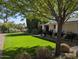 Lush green lawn and well-maintained landscaping create a serene outdoor space at 4145 E Libby St, Phoenix, AZ 85032