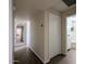 Hallway with hard surface floors, recessed lighting, and access to a bathroom at 4145 E Libby St, Phoenix, AZ 85032