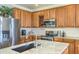 Close up on kitchen with stainless steel appliances and a large island with a sink and countertop space at 4273 E Gleneagle Dr, Chandler, AZ 85249