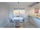 Charming dining area and updated kitchen featuring sleek appliances and a bright window at 4303 E Cactus Rd # 326, Phoenix, AZ 85032