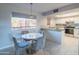 Charming dining area and updated kitchen featuring sleek appliances and a bright window at 4303 E Cactus Rd # 326, Phoenix, AZ 85032