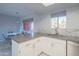 Updated kitchen space with views to the breakfast nook, granite countertops, and stainless steel appliances at 4303 E Cactus Rd # 326, Phoenix, AZ 85032