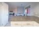 Open floorplan featuring bar seating and dining area with modern accents and marble tile flooring at 4303 E Cactus Rd # 326, Phoenix, AZ 85032