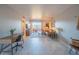 Bright living room featuring tile floors, a work space and a cozy seating area with balcony access at 4303 E Cactus Rd # 326, Phoenix, AZ 85032