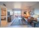Spacious living room boasts stylish furnishings, decor, and private access to outdoor patio and scenic views at 4303 E Cactus Rd # 326, Phoenix, AZ 85032