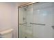 Modern shower with white subway tile, glass door, and grab bars for accessibility at 4303 E Cactus Rd # 326, Phoenix, AZ 85032