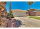 Cozy single story home with a long driveway and a two-car garage at 4330 E Desert Trumpet Rd, Phoenix, AZ 85044