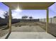 Covered patio with a backyard view and a bright sun and blue sky at 4552 S 238Th Ln, Buckeye, AZ 85326