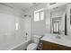 Bathroom with a shower-tub combo, single sink vanity, and ample natural light at 4552 S 238Th Ln, Buckeye, AZ 85326