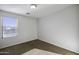 Clean bedroom showcasing neutral walls, a bright window view, and neutral carpet at 4552 S 238Th Ln, Buckeye, AZ 85326