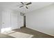 Bedroom with a neutral wall color and ceiling fan, accompanied by natural light at 4552 S 238Th Ln, Buckeye, AZ 85326
