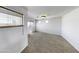 Spacious bonus room with neutral walls, carpet, and lots of natural light at 4552 S 238Th Ln, Buckeye, AZ 85326