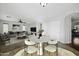 Dining and living areas are decorated with modern furniture and open living space at 4552 S 238Th Ln, Buckeye, AZ 85326