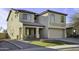 Two story home featuring neutral stucco, a tile roof and attached two car garage at 4552 S 238Th Ln, Buckeye, AZ 85326