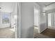 Neutral hallway provides access to several rooms, creating a sense of openness at 4552 S 238Th Ln, Buckeye, AZ 85326