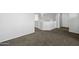 Spacious loft featuring neutral walls, carpet, and access to multiple rooms at 4552 S 238Th Ln, Buckeye, AZ 85326