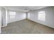 Spacious carpeted main bedroom with ensuite bathroom and lots of natural light at 4552 S 238Th Ln, Buckeye, AZ 85326