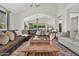 Comfortable living room featuring hardwood floors, an arched doorway, and a leather sectional at 4639 N 29Th St, Phoenix, AZ 85016