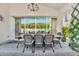 Covered patio features a large dining table, chairs and large sliding glass door for indoor/outdoor living at 4639 N 29Th St, Phoenix, AZ 85016