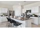 Modern kitchen island featuring a granite countertop, stainless steel appliances, and white cabinetry at 469 N 17Th St, Coolidge, AZ 85128