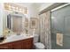 Updated bathroom with a cherry vanity, walk-in shower, and modern fixtures at 4800 N 68Th St # 263, Scottsdale, AZ 85251