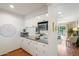 Efficient kitchen with white cabinetry, granite countertops, and modern appliances at 4800 N 68Th St # 263, Scottsdale, AZ 85251