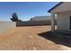 Spacious backyard ready for customization with block wall fence and covered patio at 481 N 17Th St, Coolidge, AZ 85128