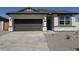 Charming single story home with a two car garage and desert landscaping at 481 N 17Th St, Coolidge, AZ 85128