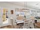 Dining room with a modern light fixture and tufted chairs at 4979 E Colonial Dr, Chandler, AZ 85249