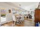 Open concept dining area with wood floors and views to the backyard at 4979 E Colonial Dr, Chandler, AZ 85249