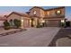 Expansive two-story home boasts a three-car garage and covered porch, perfect for Gathering living at 4979 E Colonial Dr, Chandler, AZ 85249