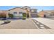 Charming home featuring xeriscaped yard and inviting curb appeal, complete with walkway stones at 4979 E Colonial Dr, Chandler, AZ 85249