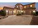 This stunning home boasts an oversized three-car garage, and inviting front porch perfect for relaxing at 4979 E Colonial Dr, Chandler, AZ 85249