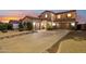 Expansive two-story home boasts a three-car garage and covered porch, perfect for Gathering living at 4979 E Colonial Dr, Chandler, AZ 85249